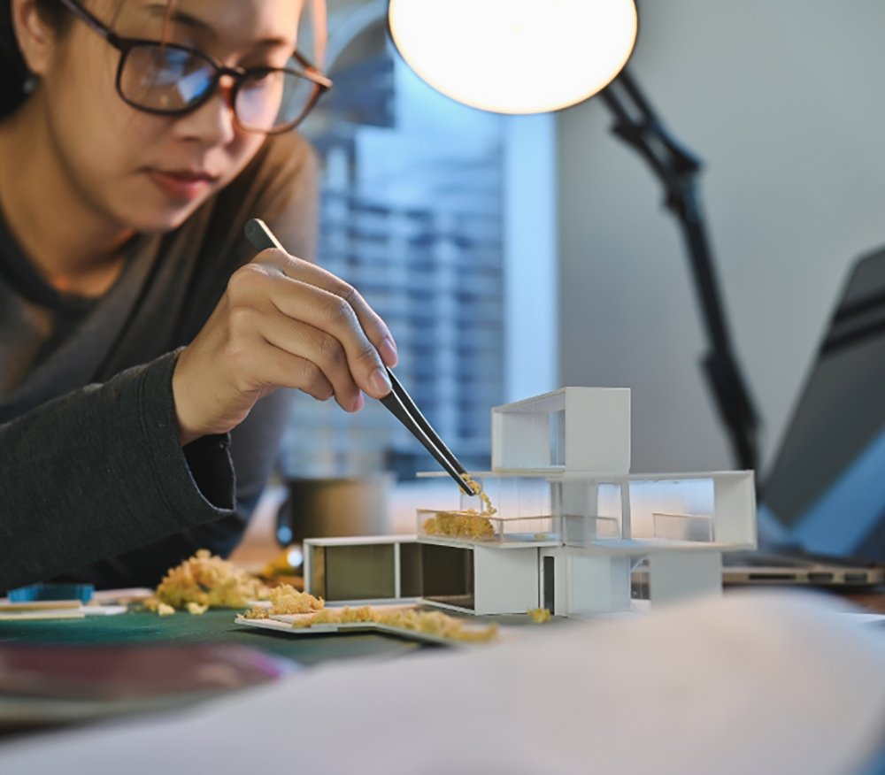 Girl creating an architectural model