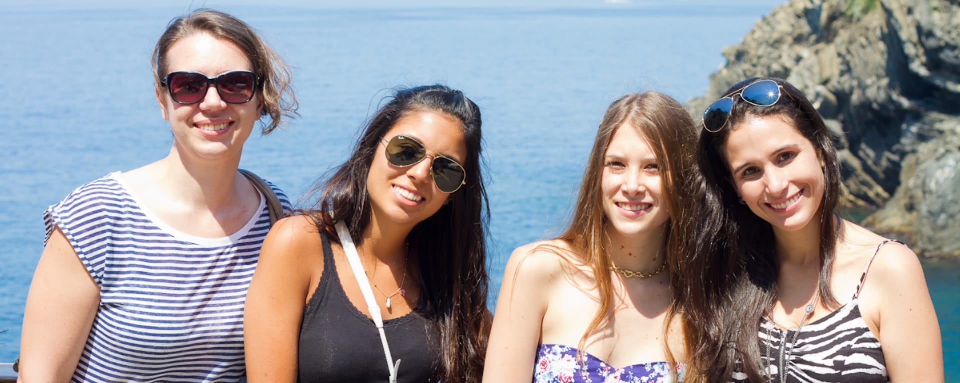 Four girls smiling